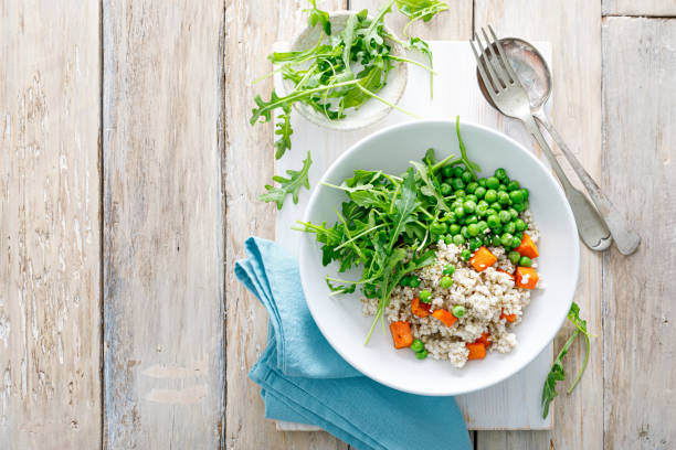 Barley porridge with green peas, baked pumpkin and fresh arugula salad